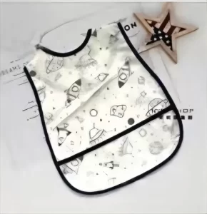 Miniatura 1 de 9 de Babero Impermeable Bebé PU Con Bolsillo