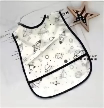 Imagen 1 de 8 de Babero Impermeable Bebé Pu Animales Y Espacio Con Bolsillo Surtido